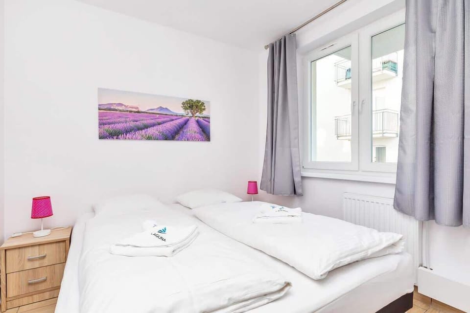 The serene bedroom offers a comfortable double bed for a restful night's sleep.