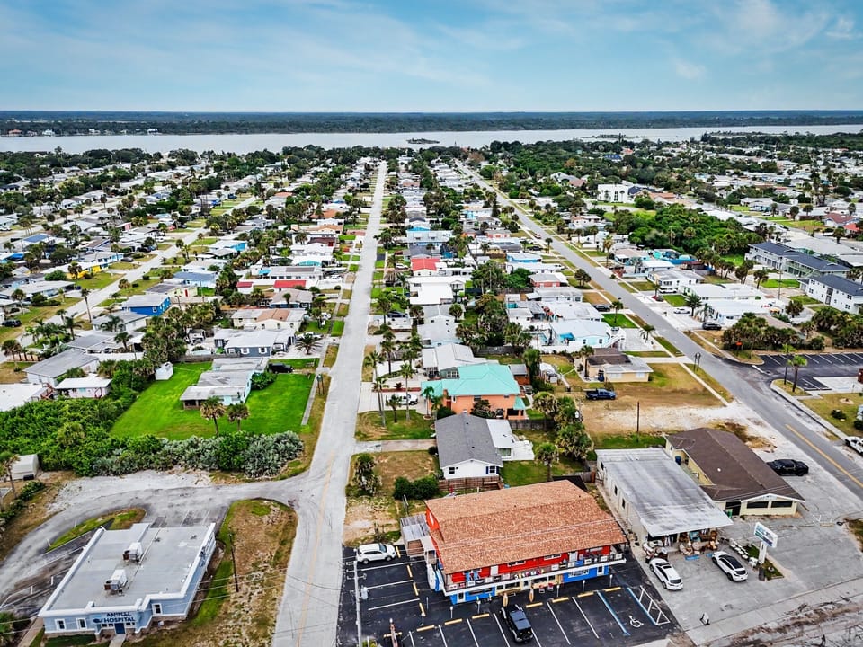 Short walk west to the Intracoastal River. Bright blue roof house
