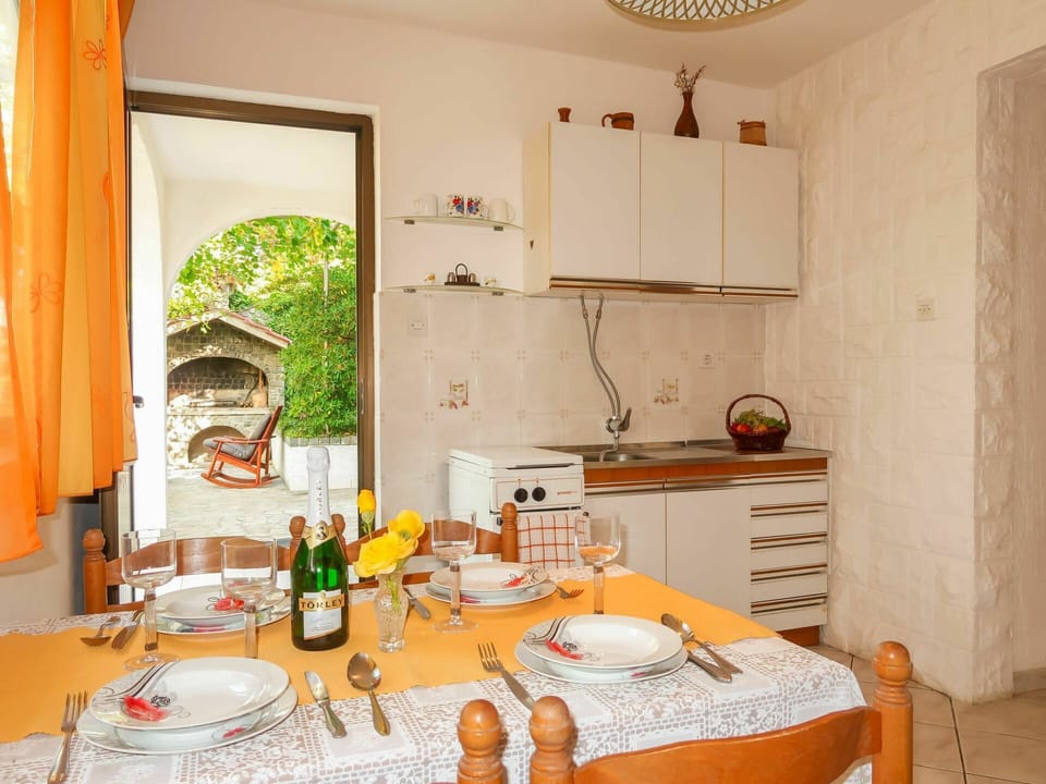 Room, Property, Furniture, Orange, Interior Design, Yellow, Dining Room, Table, Building, House