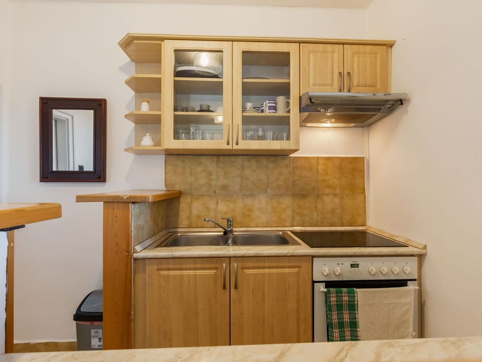 Furniture, Cabinetry, Countertop, Kitchen, Wood, Kitchen Appliance, Interior Design, Flooring, Cupboard, Major Appliance