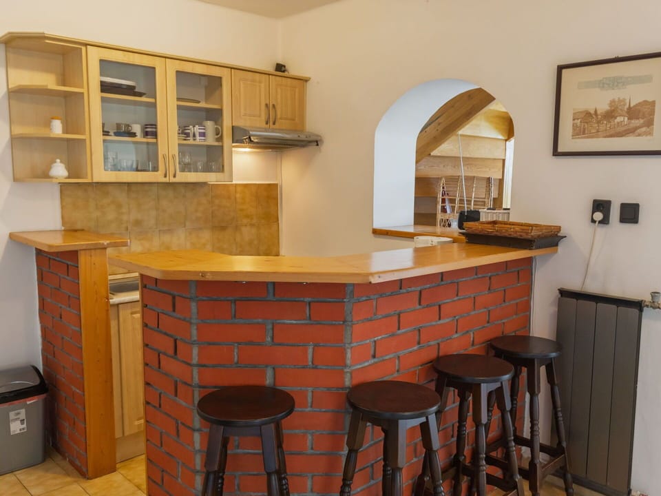 Furniture, Wood, Interior Design, Flooring, Bar Stool, Countertop, Wood Stain, Cabinetry, Chair, Kitchen