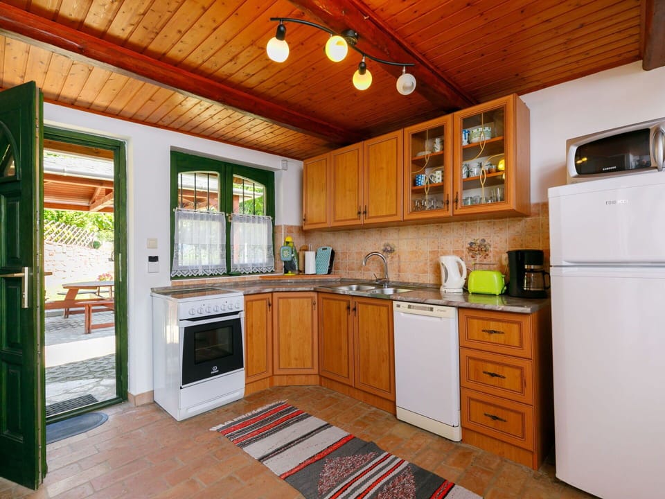 Cabinetry, Countertop, Kitchen, Wood, Kitchen Stove, Kitchen Appliance, Interior Design, Floor, Flooring, Drawer
