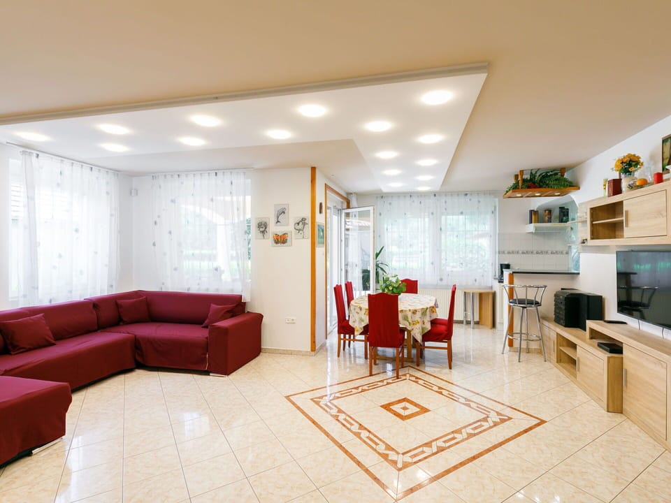 Furniture, Couch, Chair, Television, Living Room, Flooring, Comfort, Interior Design, Floor, Decoration