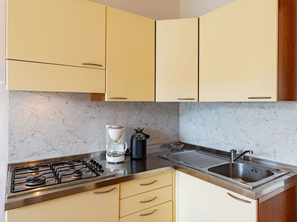 Cabinetry, Countertop, Property, Kitchen Sink, Sink, Kitchen Stove, Kitchen Appliance, Gas Stove, Cooktop, Kitchen