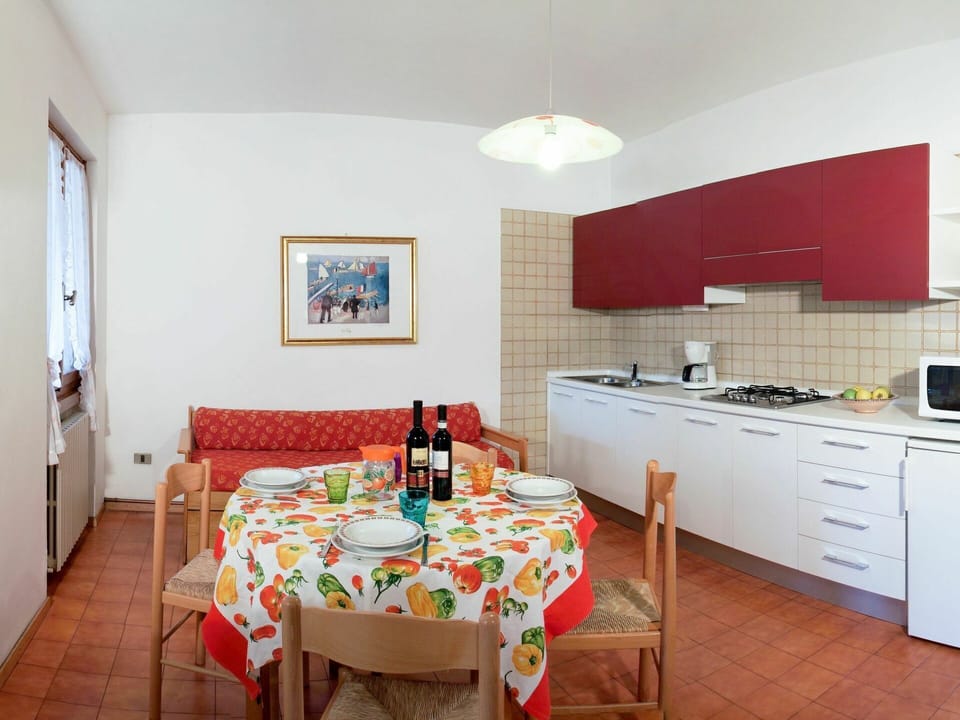 Furniture, Table, Cabinetry, Countertop, Building, Chair, Sink, Tap, Kitchen Stove, Tablecloth