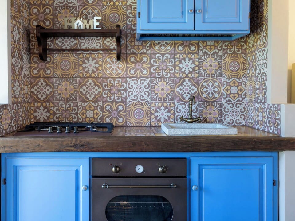Blue, Kitchen, Interior Design, Countertop, Flooring, Floor, Cabinetry, Tile, Kitchen Appliance, Room