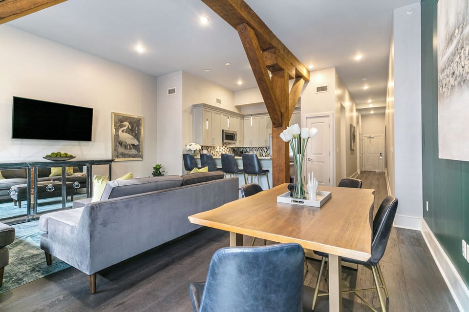 Open concept living, kitchen, dining area with comfortable seating options for you and your guests. 58” Samsung Smart 4K TV for streaming from apps, along with the DIRECTV Entertainment. Dining table with seating for four. All the natural light too!