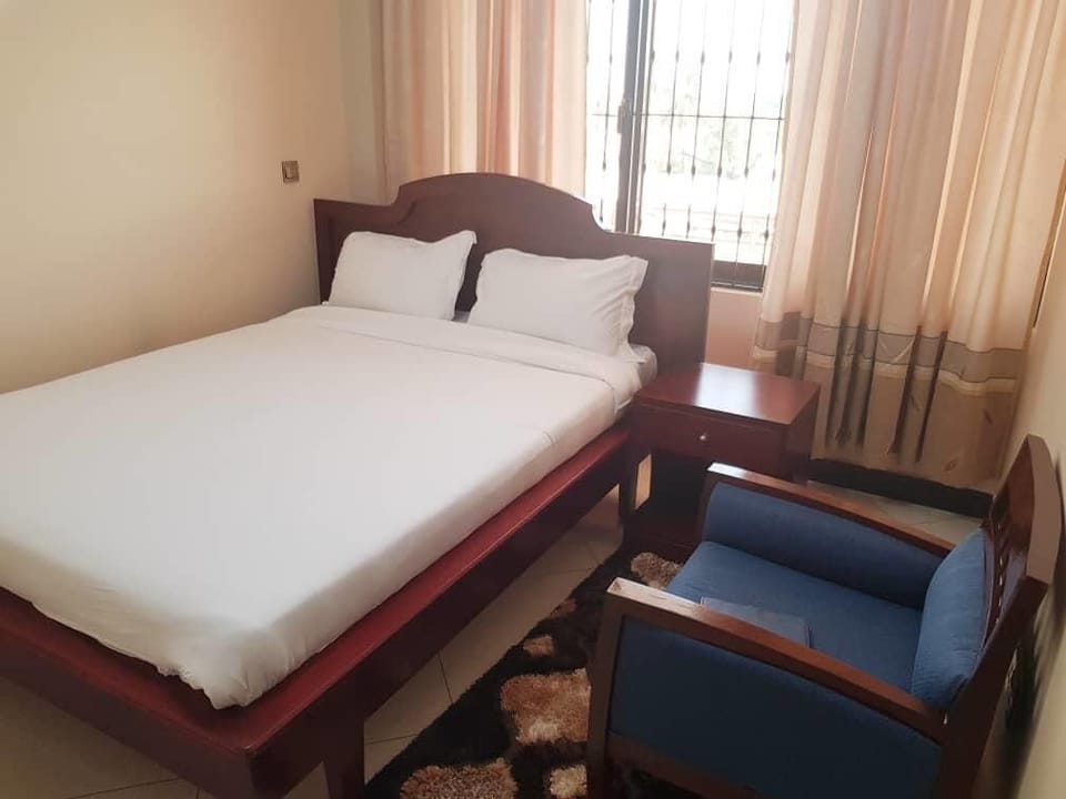 Deluxe Room, 1 King Bed, Non Smoking, City View | In-room safe, individually decorated, desk, iron/ironing board