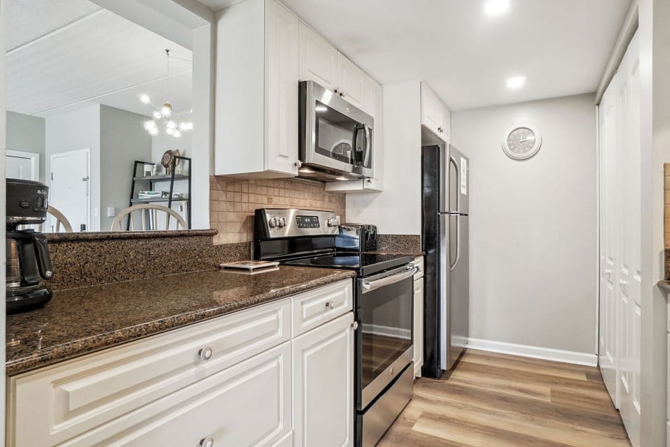 Full Size Kitchen stocked with appliances, dinnerware, and cookware