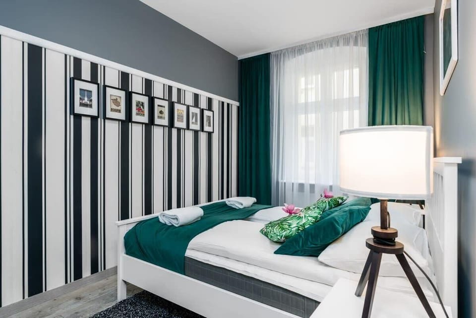 The bedroom's soft lighting and elegant decor ensure a restful night's sleep.