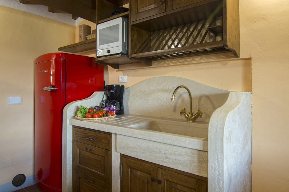 Apartment, 1 Bedroom, Smoking, Pool Access | Private kitchen | Microwave, coffee/tea maker, cookware/dishes/utensils