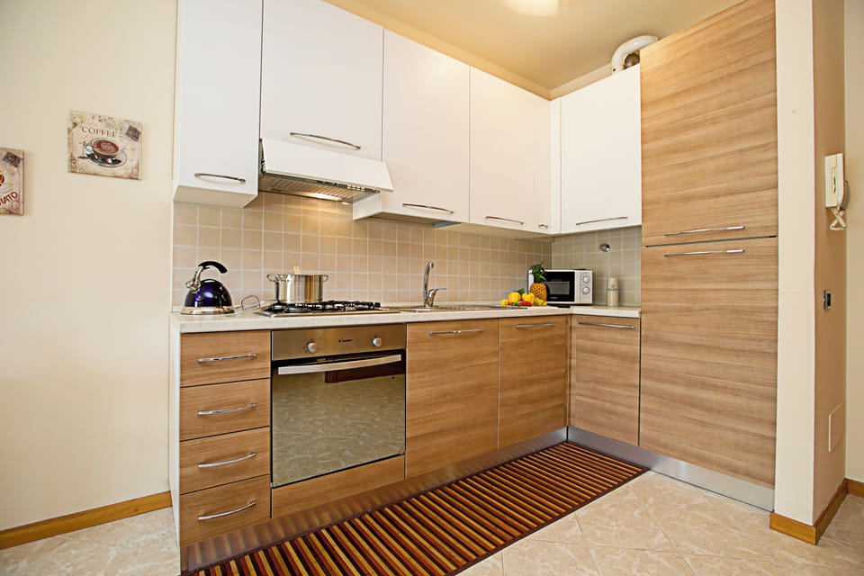 Family Apartment, 1 Bedroom, Microwave (Casa Kristall Lago) | Private kitchen | Full-size fridge, microwave, oven, stovetop
