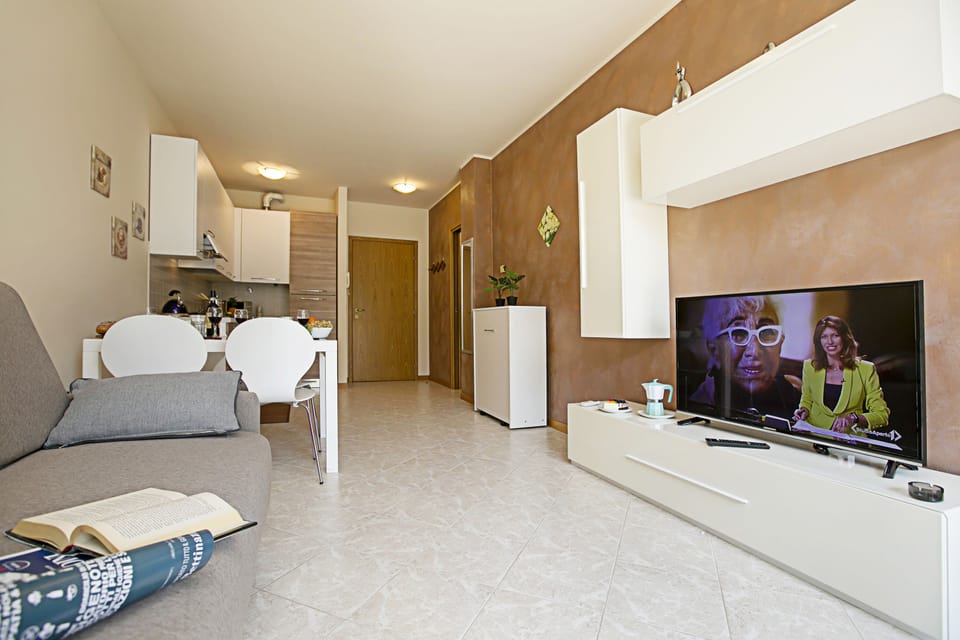 Family Apartment, Multiple Bedrooms (Casa Kristall Lago) | Living area | 21-inch flat-screen TV with cable channels, TV