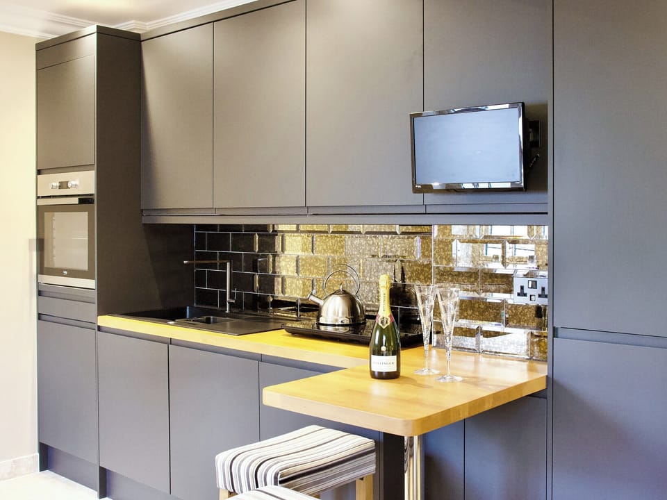 Compact kitchen with breakfast bar | The White House Studio, Worthing