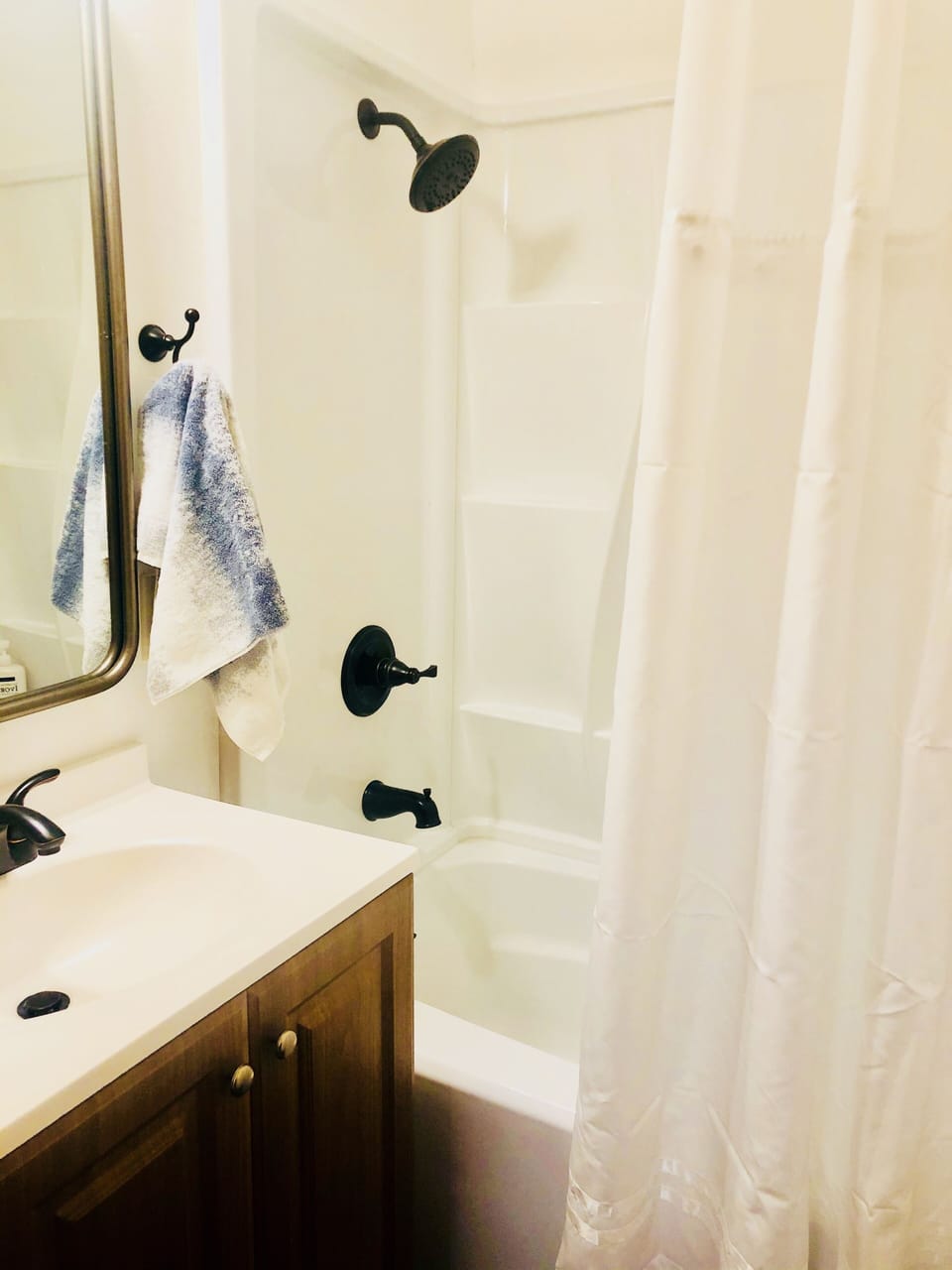Full size bathroom with Tub/Shower combo.