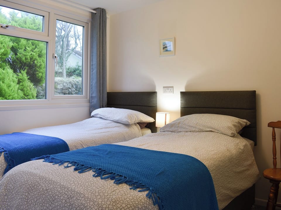 Inviting bedroom with twin single beds | Chalet 4 - Mount Hawke Holiday Bungalows, Mount Hawke, near Redruth