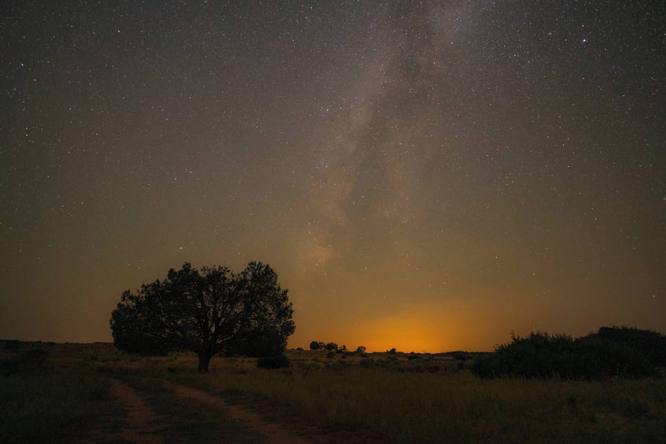 Stargazing from your glamping tent under peaceful Southern Utah night skies, the perfect way to end a day of adventure.