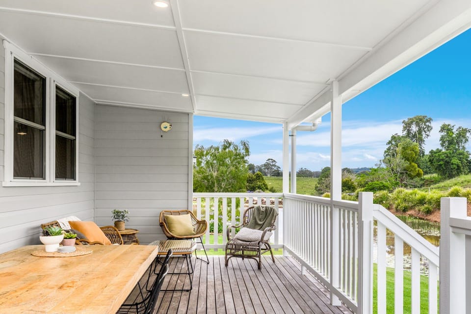 Outside dining and seating area with BBQ on the verandah of Violet, Forget Me Not Farm Cottages
