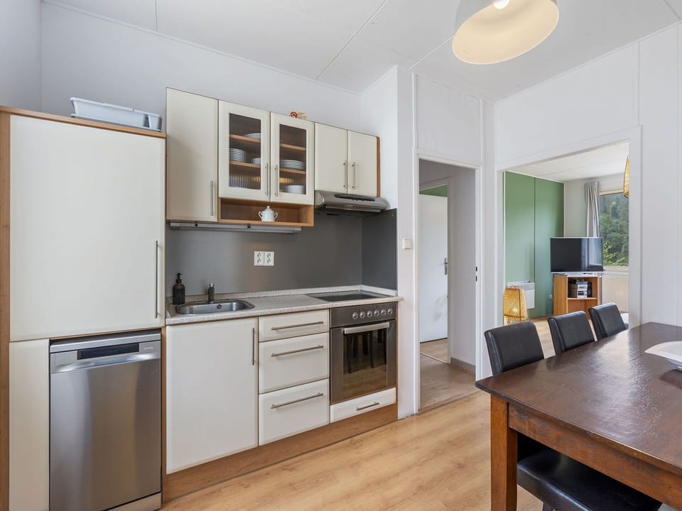 Furniture, Interior Design, Kitchen, Kitchen Appliance, Flooring, Major Appliance, Cabinetry, Floor, Wood, Countertop
