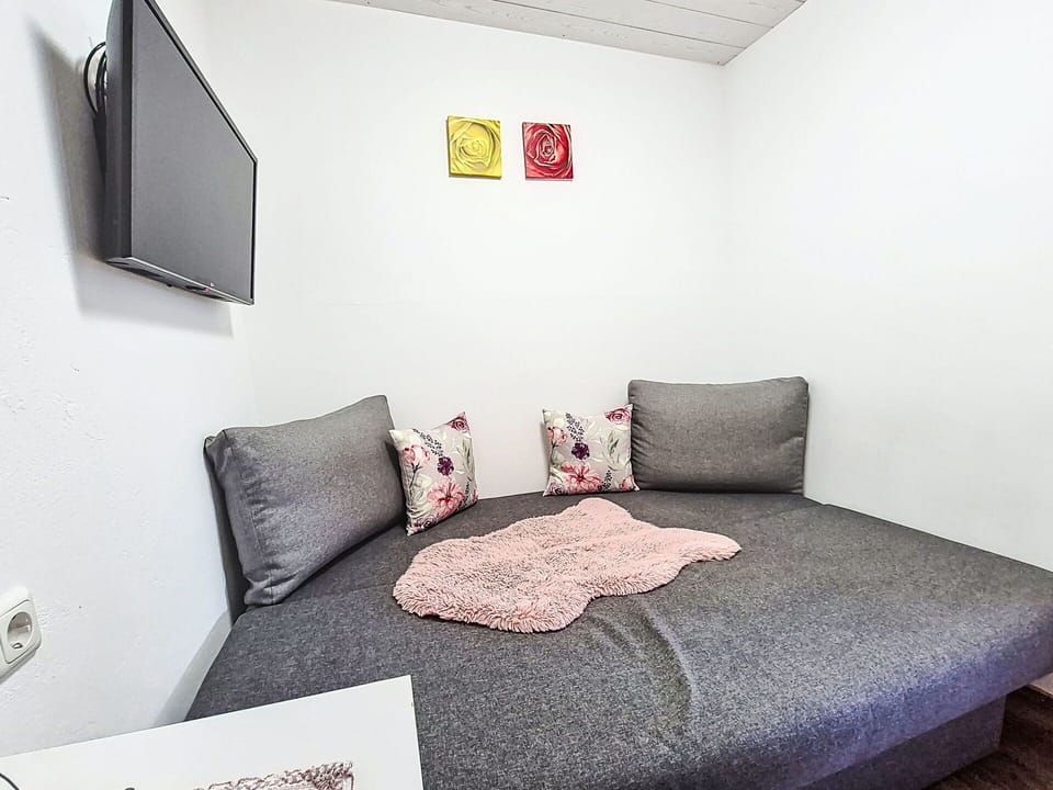 Furniture, Wall, Interior Design, Floor, Flooring, Room, Textile, Bedroom, Cushion, Bed