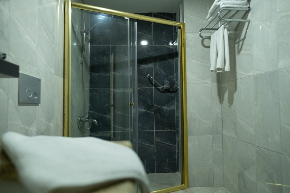 Family Room | Bathroom | Shower, slippers, towels