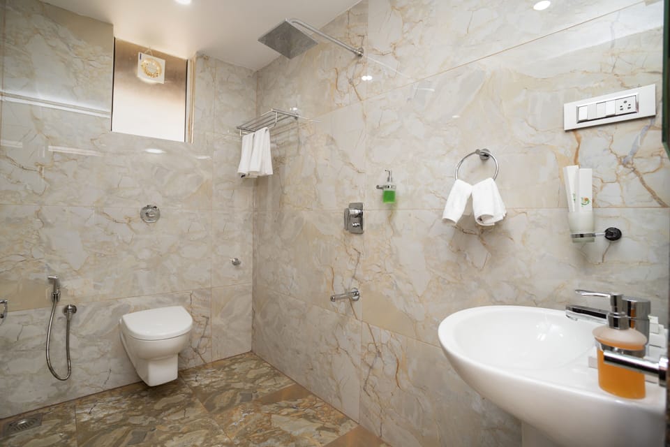 Shower, free toiletries, slippers, towels