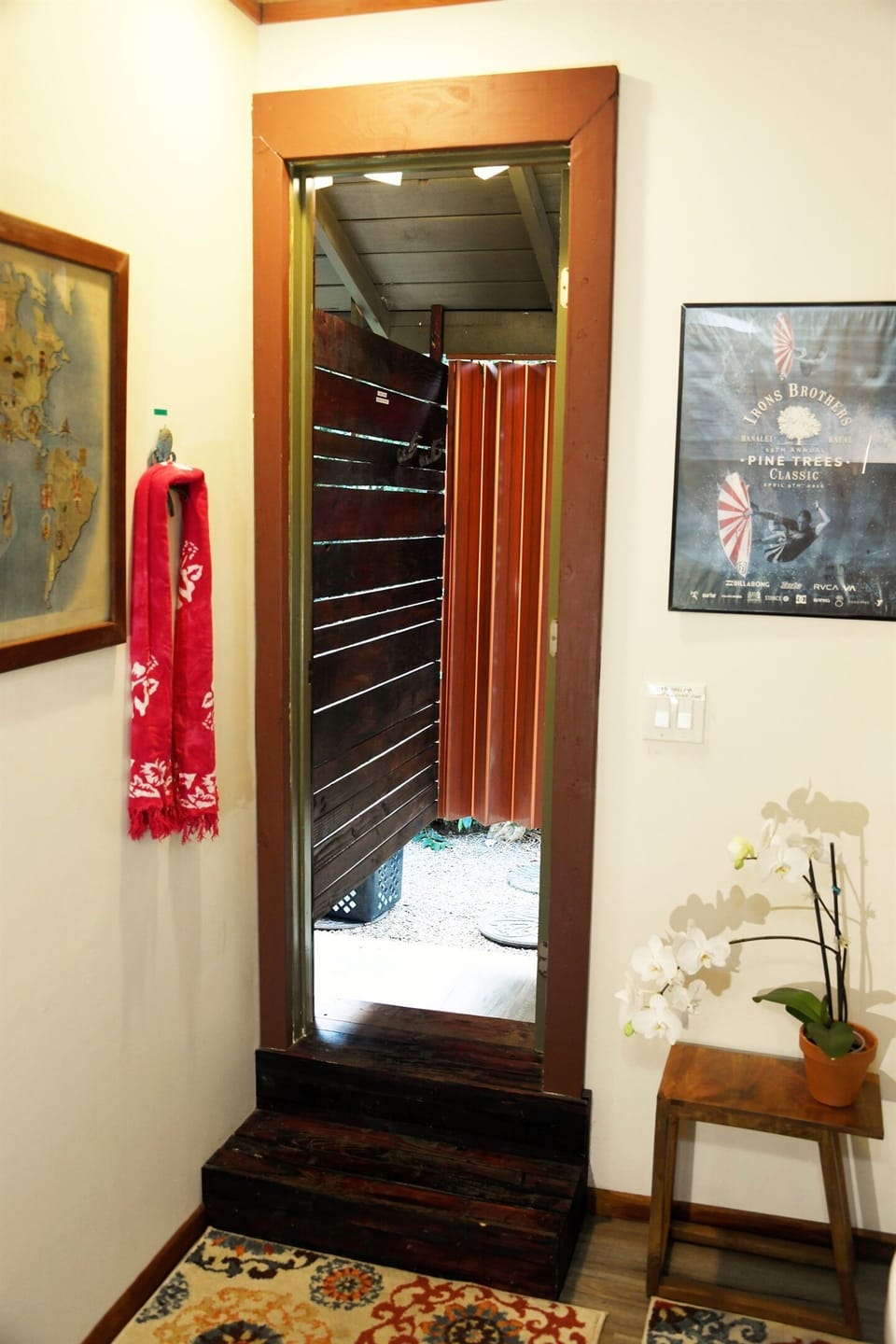 The door leading out to the outdoor shower from the bathroom
