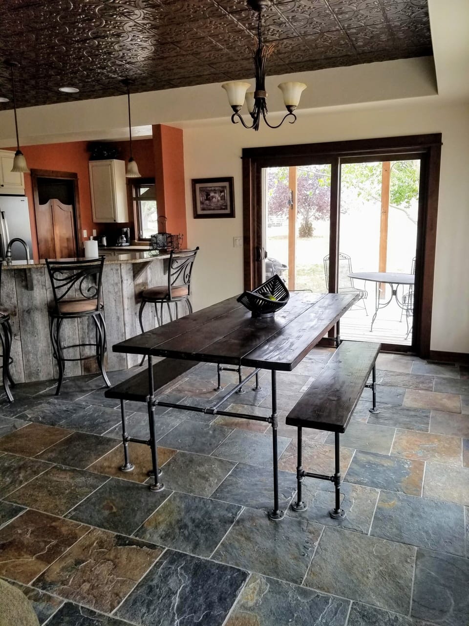 The dining area features slate floors and a walk out patio.