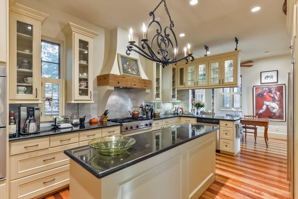 Kitchen with Sub- zero refrigerator, gas cooktop,  grill, 2 electric ovens. 