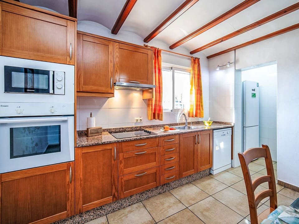 Kitchen, Wood, Furniture, Countertop, Flooring, Major Appliance, Cabinetry, Interior Design, Kitchen Appliance, Home