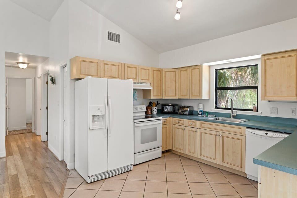 The kitchen features all necessary small and large appliances for a comfortable stay