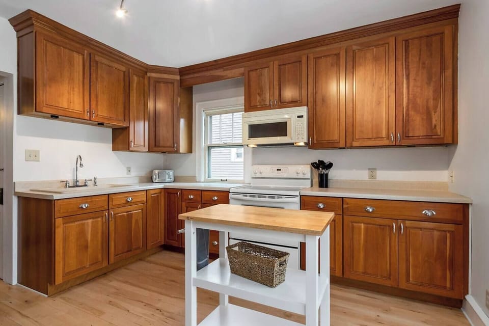 The kitchen is completely stocked with brand new dishes, pots, pans, and all the gadgets you need to make a great meal.