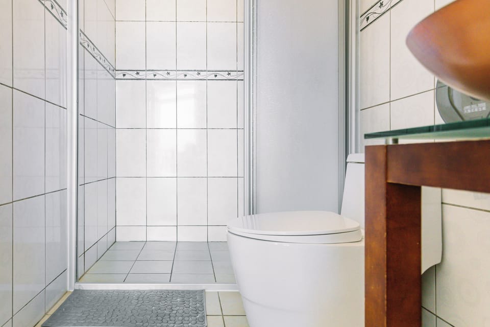Double room with balcony | Bathroom | Hair dryer, slippers, towels, shampoo