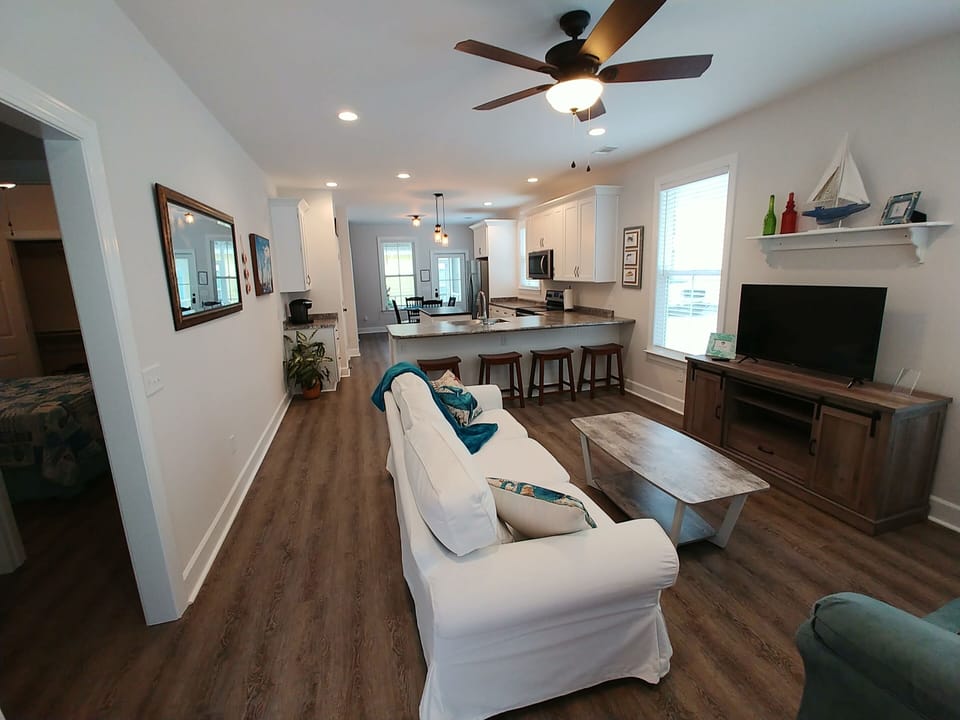 Walking in front door. Open living area.