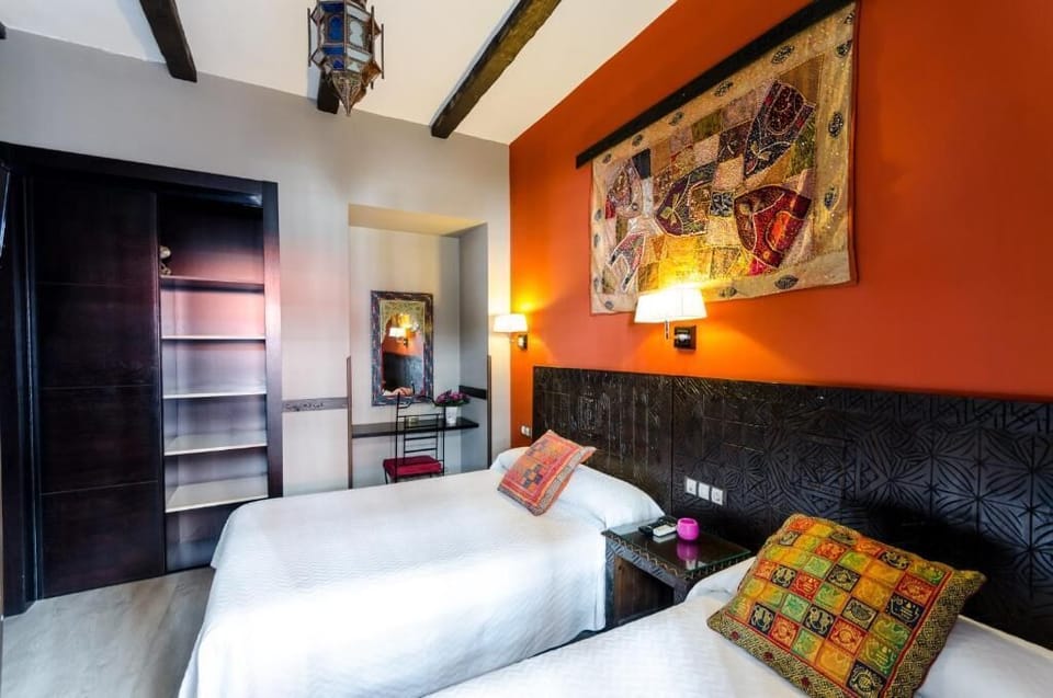 Triple Room | Down comforters, in-room safe, desk, blackout drapes