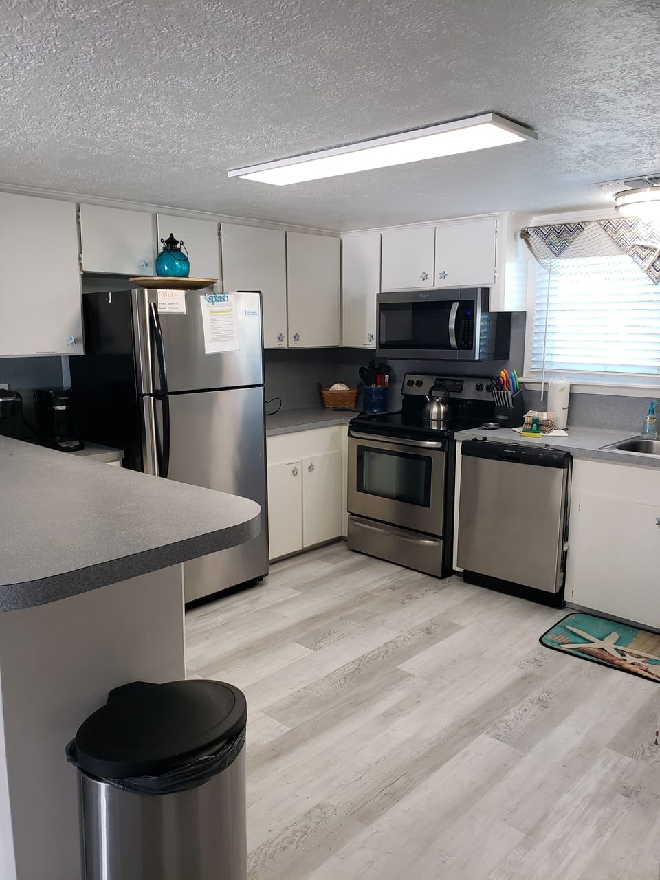 Well equipped kitchen with stainless steel appliances. 
