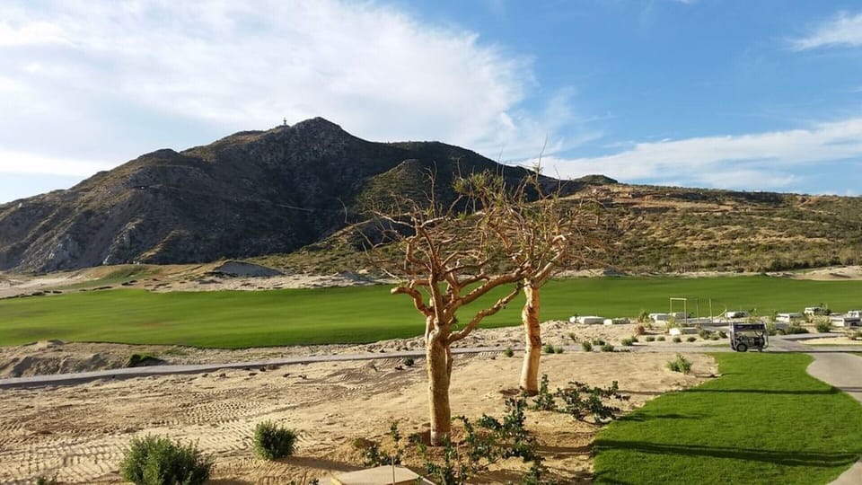 The lighthouse is in the distance across the 18th hole.