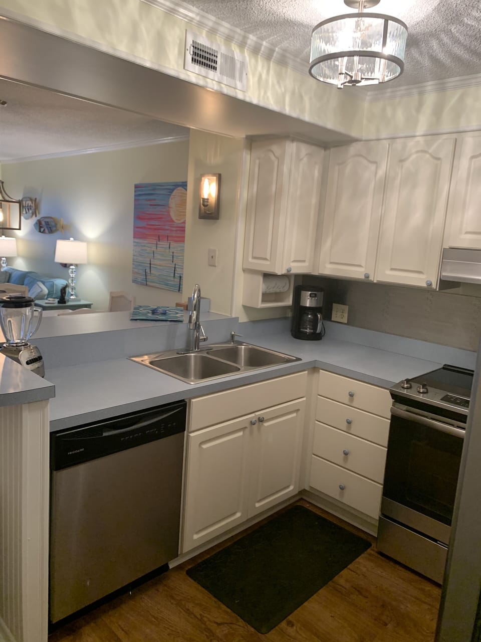 Kitchen features new stainless backsplash