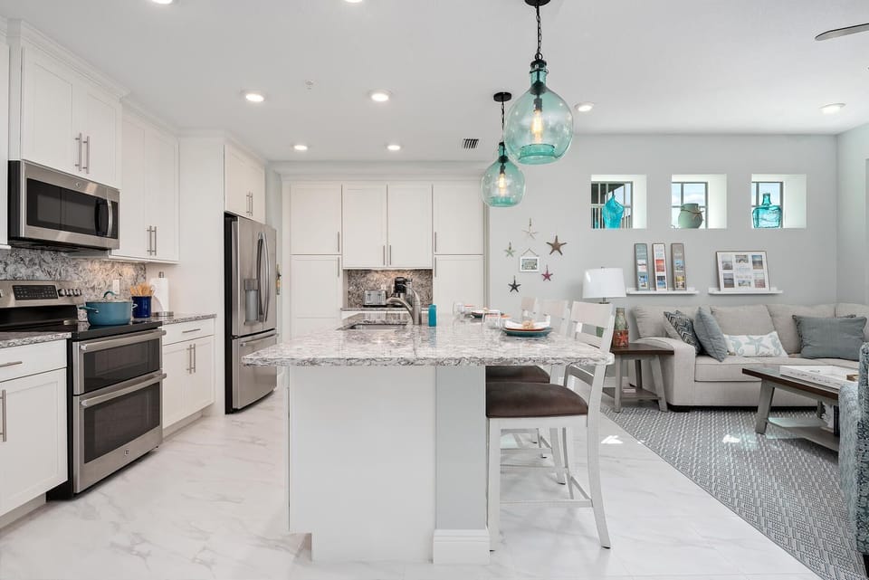 open floor plan, fully stocked kitchen