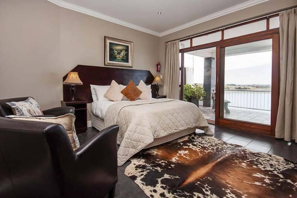 Deluxe Double Room, 1 King Bed, Balcony, River View | In-room safe, individually decorated, desk, laptop workspace