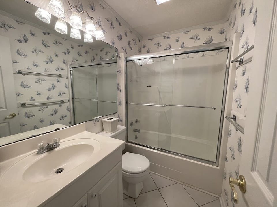 Hall Bath features a single vanity & shower/tub combo