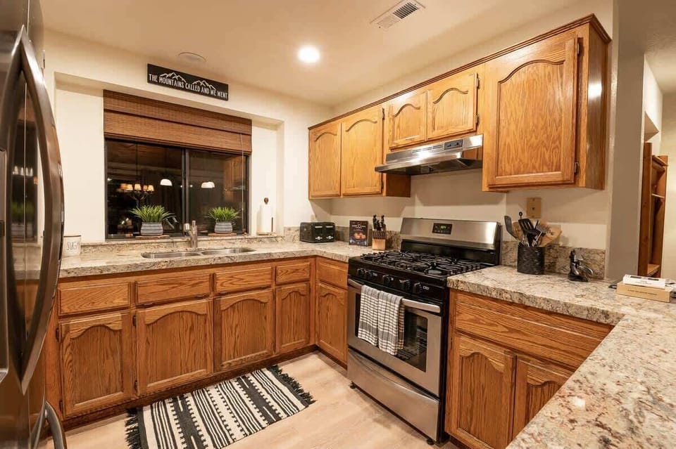Fully stocked, stainless-steel kitchen.