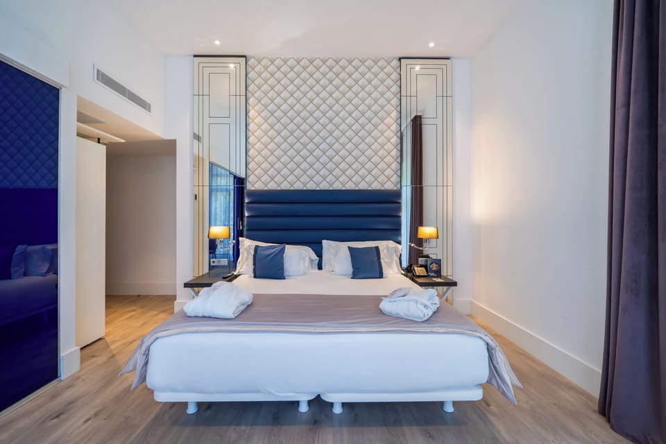 Premium bedding, down comforters, memory foam beds, minibar