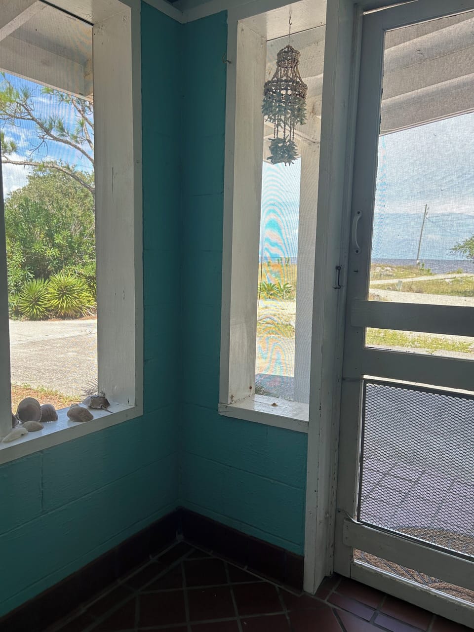 side view of the gulf sitting on the porch glider 