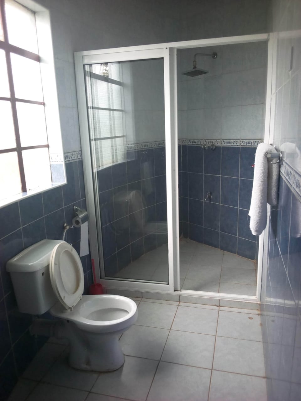 Shower, free toiletries, slippers, towels