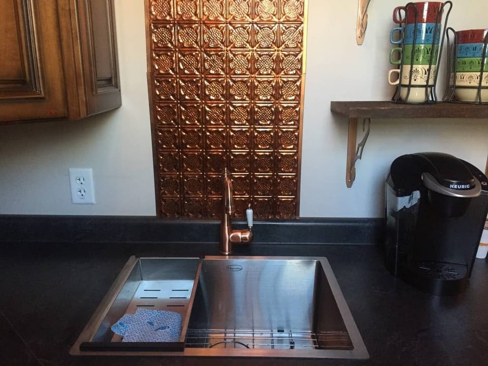Fully-stocked with large sink and kitchen utensils