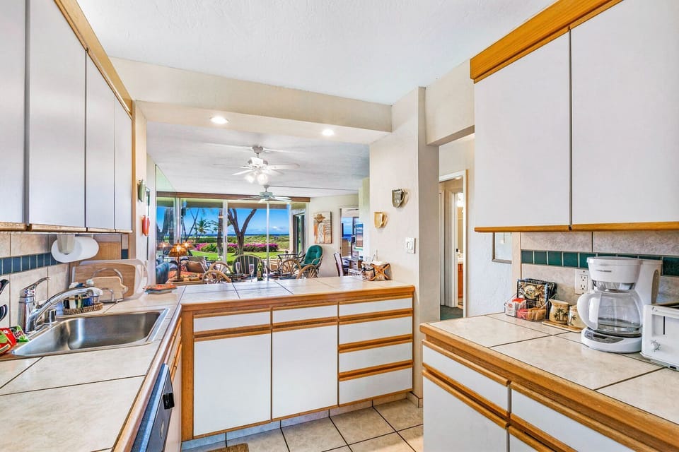 Well stocked with kitchen ware and appliances.