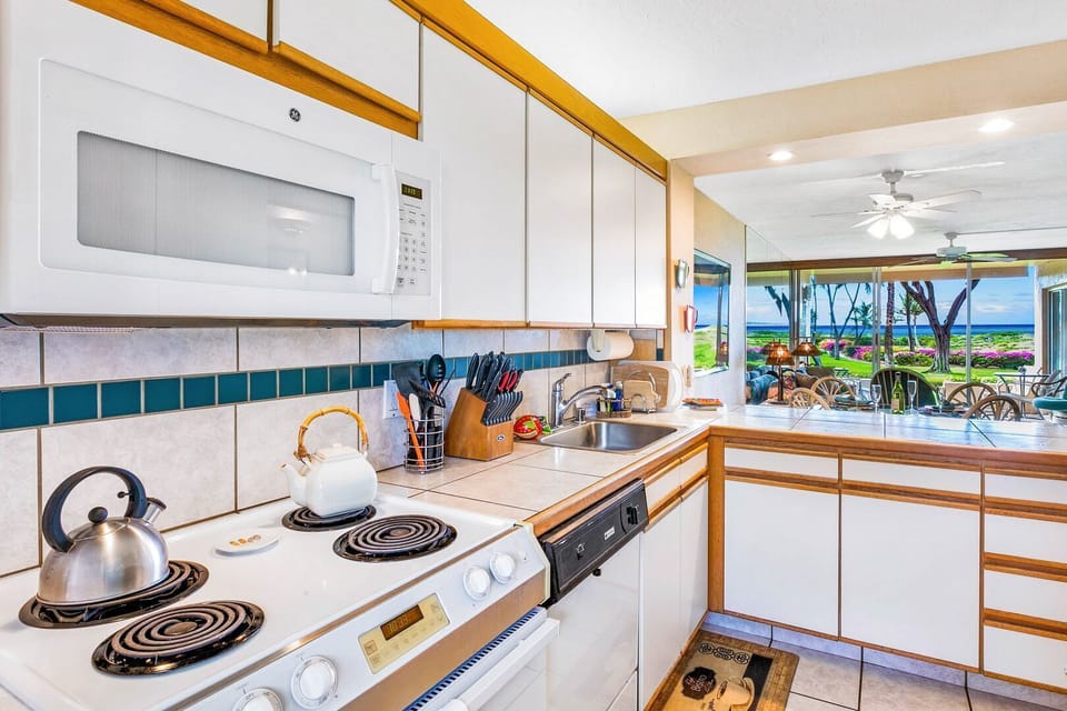The tiled counter top and updated kitchen is perfect for dining in.