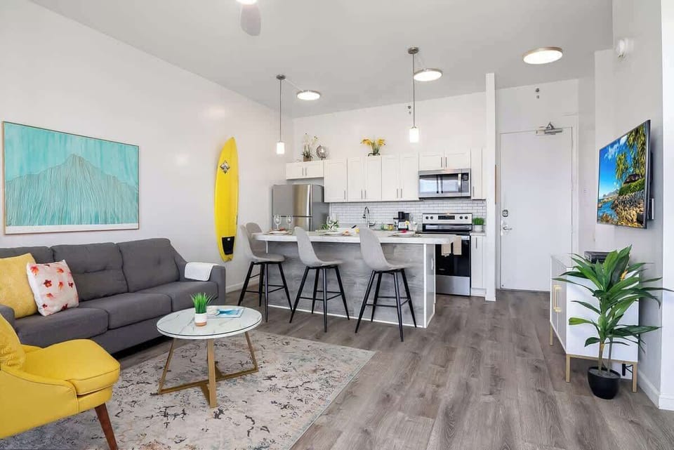 Overview of the living room, dining area, and kitchen