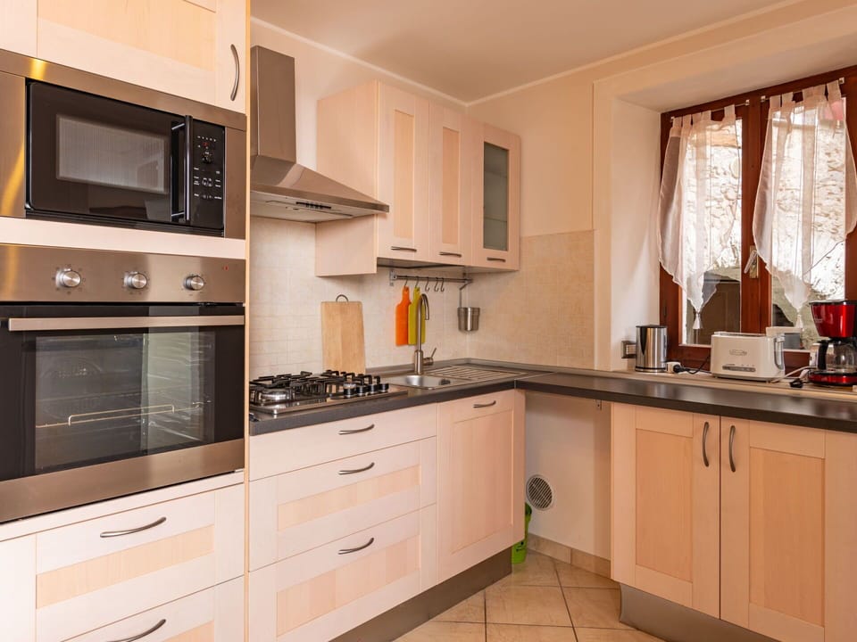 Cabinetry, Countertop, Property, Kitchen Stove, Window, Kitchen Appliance, Wood, Home Appliance, Kitchen, Drawer